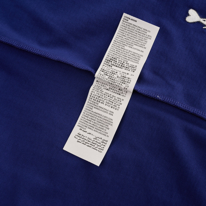 AMI royal blue cotton graphic T-shirt with 'Thank You For Being A Friend' slogan print in cream lettering, featuring a contrast cream ribbed crew neckline and AMI de Cœur logo at the hem - view 4