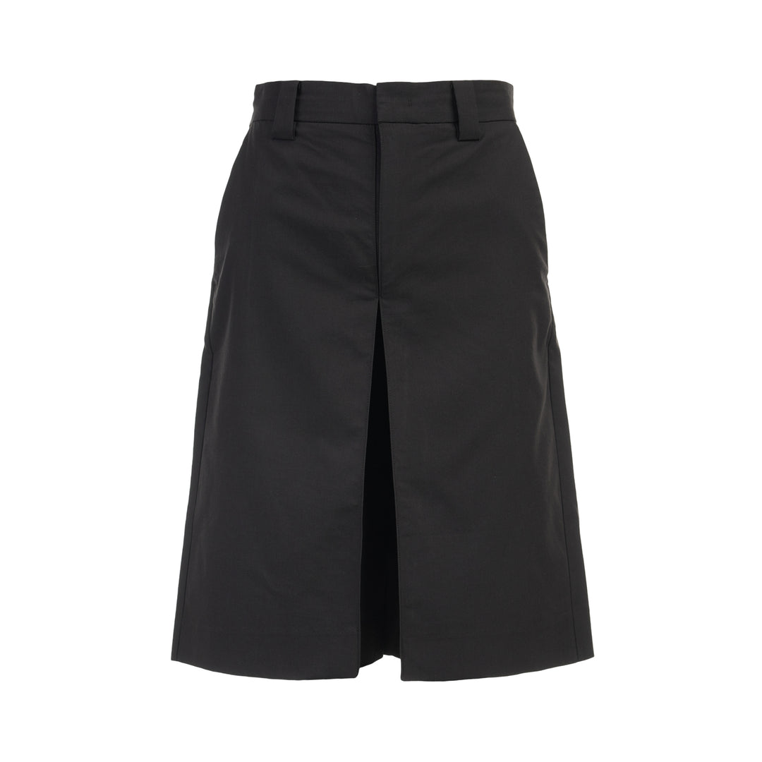 Black longline tailored shorts with a front box pleat, belt loops and concealed fly closure, shown from the front
