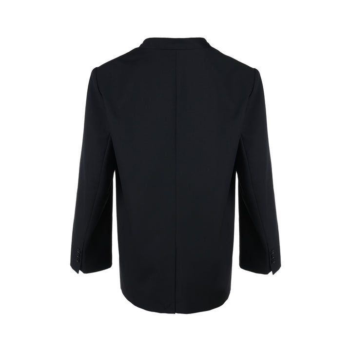 Black collarless wool-blend blazer with deep V neckline, single button closure and welt chest pocket, shown against a white background - view 2