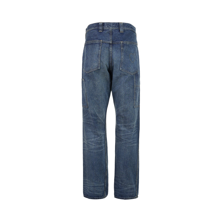 Human Made slim denim pants in a washed mid-indigo finish, shown front-facing with button fly and contrast topstitching - view 2