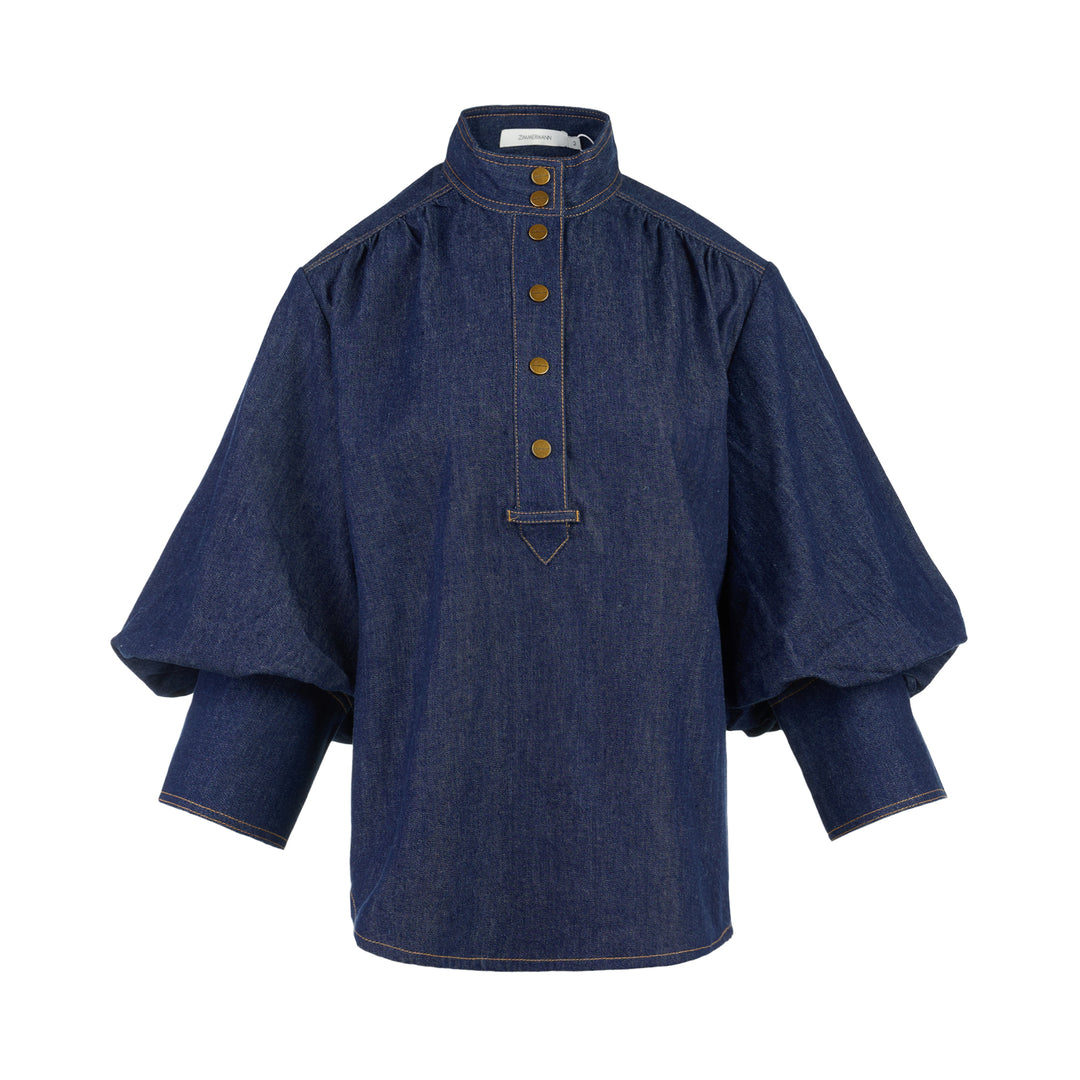 Zimmermann Denim Billow Shirt in dark indigo with stand collar, gold-tone buttons, contrast topstitching and balloon sleeves