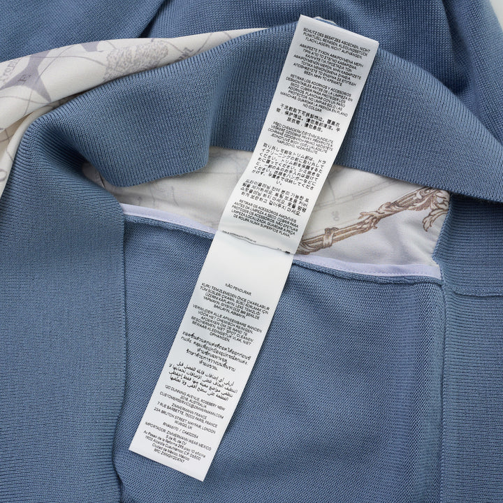 Zimmermann Valiant long sleeve polo with a silk front panel printed with a vintage world map and aeroplanes, framed by blue knit collar, sleeves, and hem - view 5