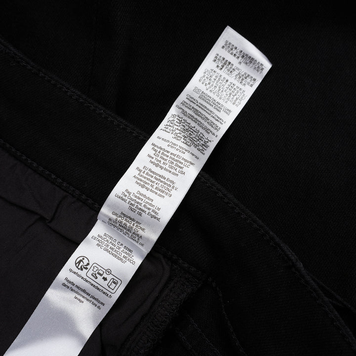 rag & bone Flexi Wren mid-rise full slim jeans in black stretch denim with five-pocket styling and rolled cuffs, shown from the front - view 6