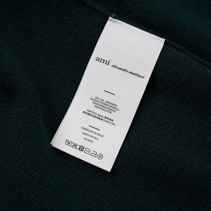 AMI Quota crewneck cardigan in deep forest green with black buttons, ribbed hem and cuffs, and a tonal embroidered heart logo on the chest - view 3