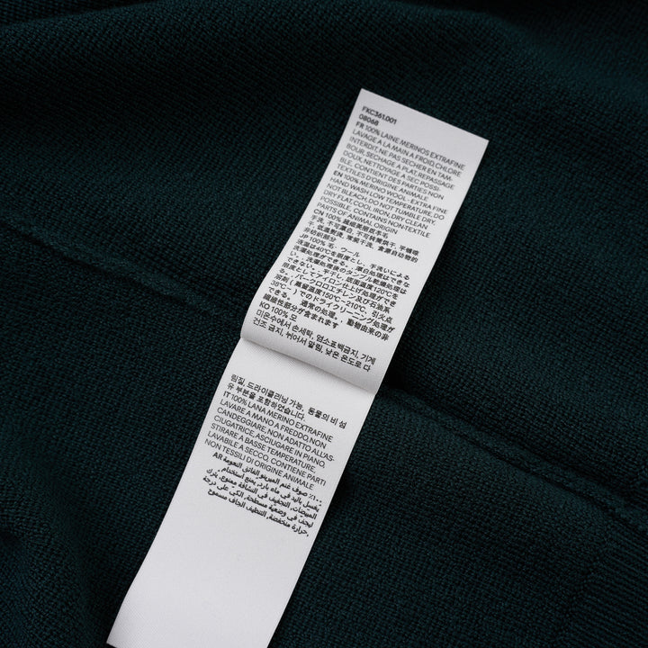 AMI Quota crewneck cardigan in deep forest green with black buttons, ribbed hem and cuffs, and a tonal embroidered heart logo on the chest - view 4
