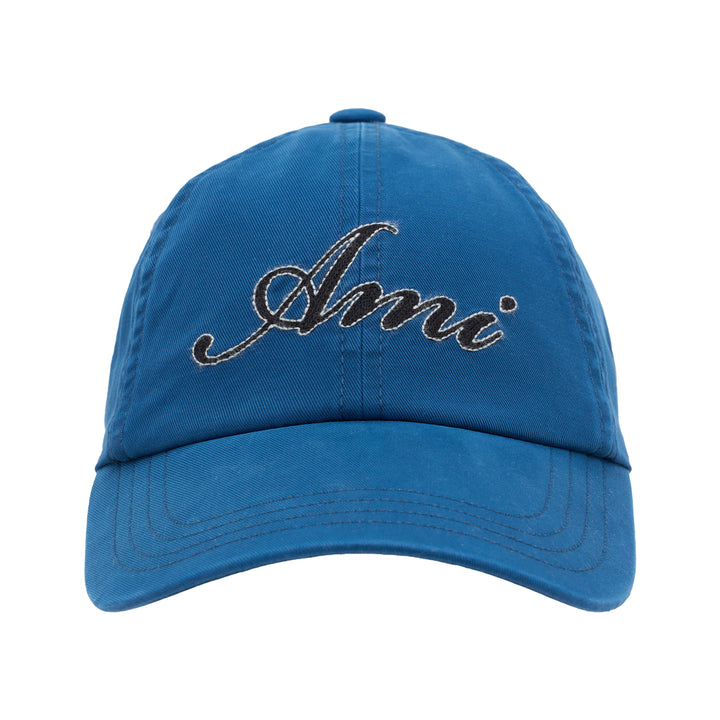 AMI blue cotton twill baseball cap with black script logo embroidered at the front and curved stitched brim
