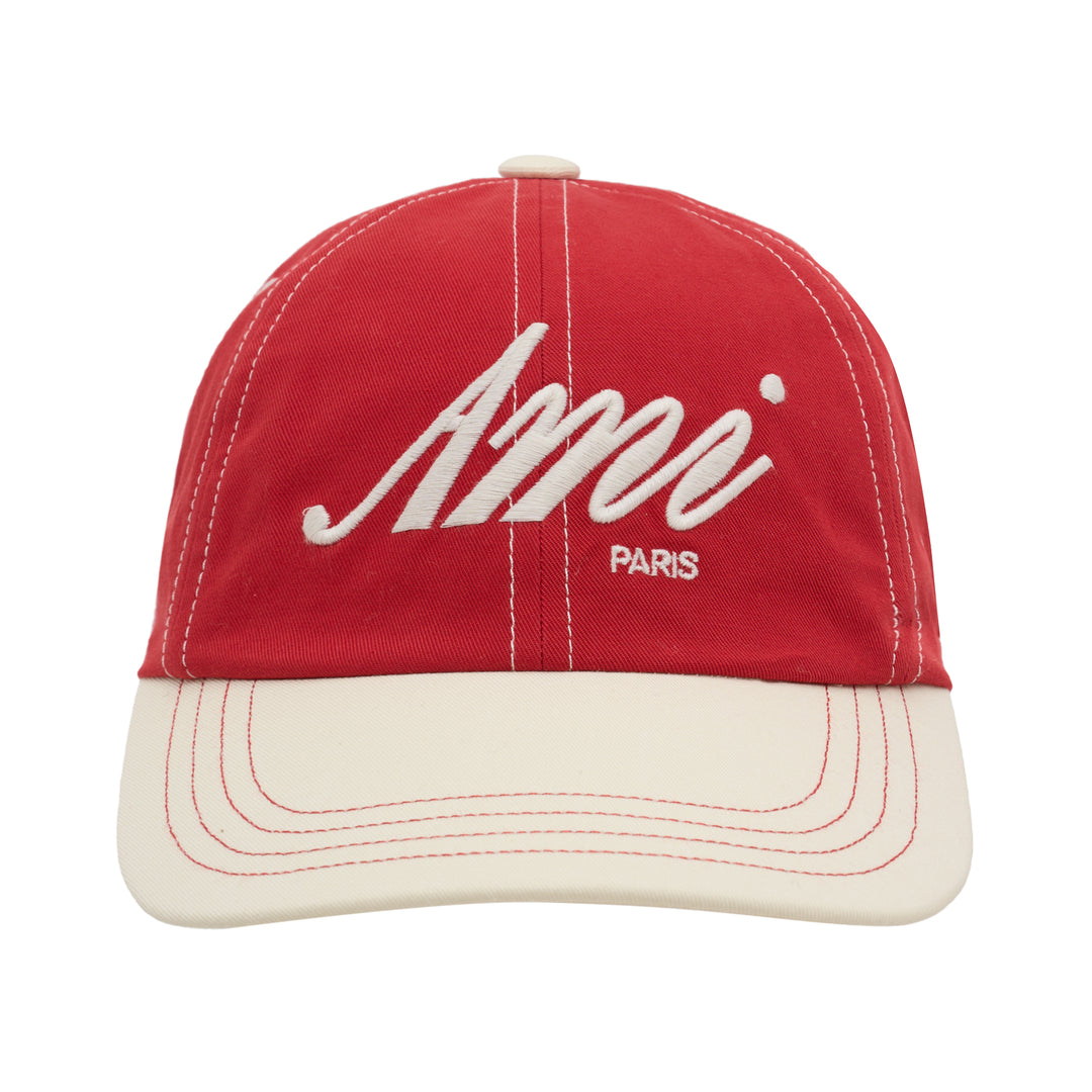 AMI bicolor baseball cap in red with a cream peak, featuring white script logo embroidery, Paris lettering and contrast stitching