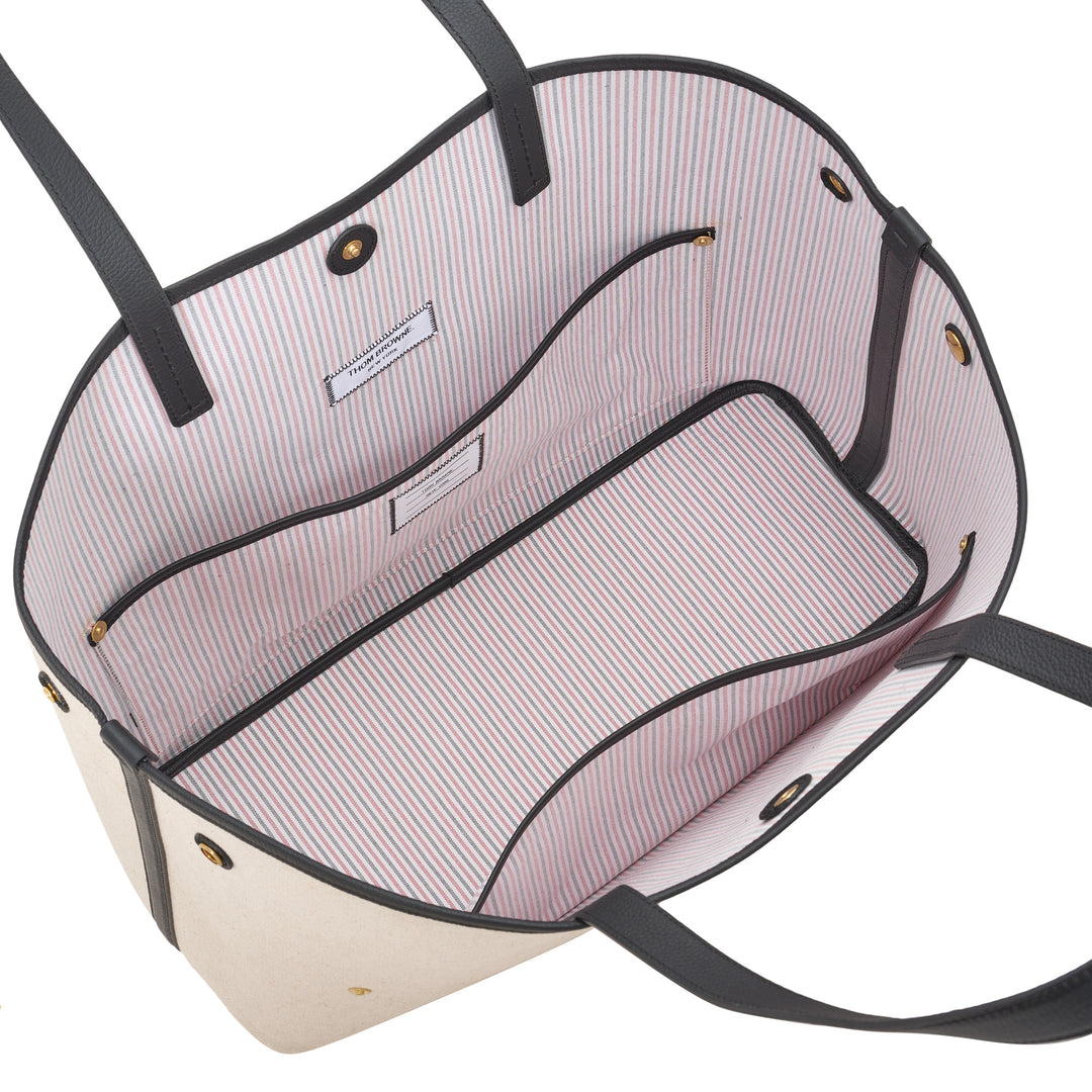 Thom Browne horizontal canvas tote bag with black leather handles, gold-tone studs and a red, white, and blue vertical stripe - view 4