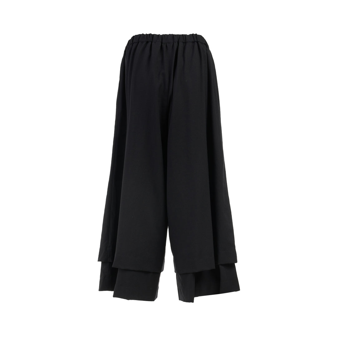 Comme des Garçons black wool georgette wide-leg pants with an elasticated waist and double-layered hem, shown from the front - view 2