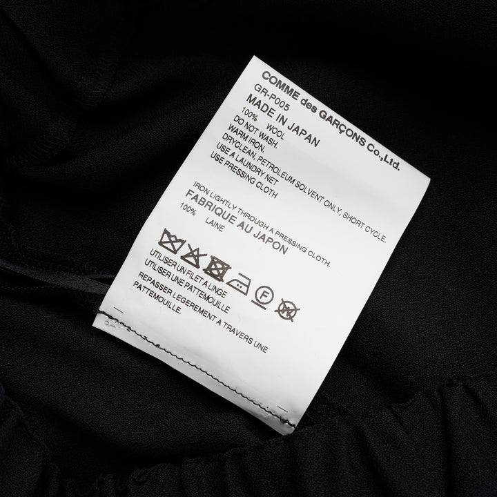Comme des Garçons black wool georgette wide-leg pants with an elasticated waist and double-layered hem, shown from the front - view 3