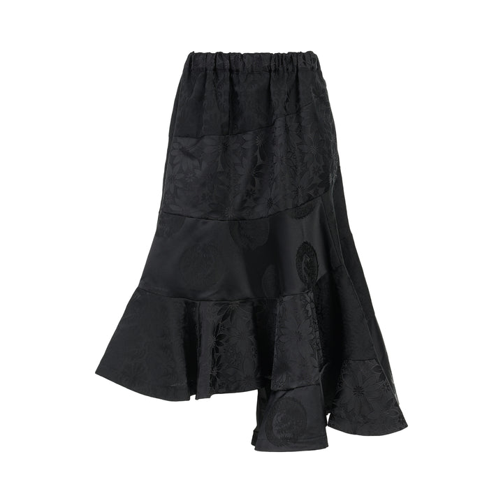 Black jacquard patchwork midi skirt with elasticated waist and asymmetric tiered flounce hem by Comme des Garçons Comme des Garçons