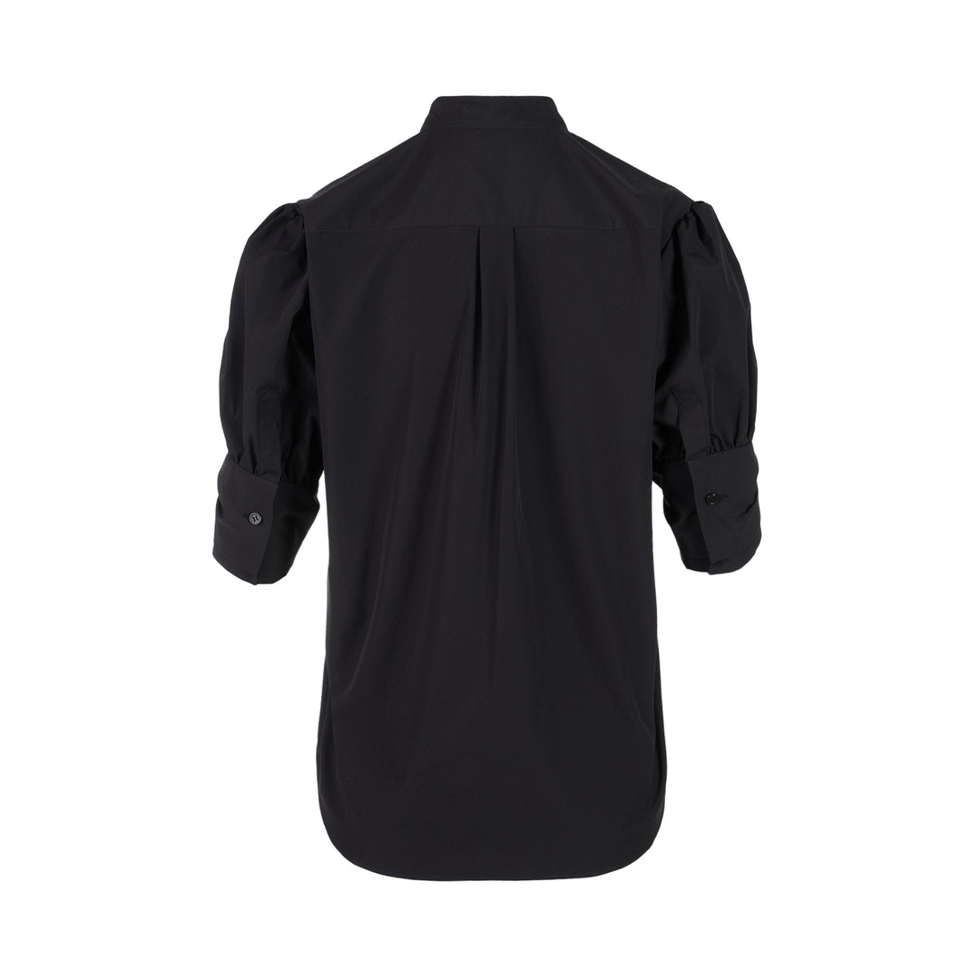 Noir Kei Ninomiya black button-up shirt with band collar, oversized bow with buckle straps across the chest and puffed elbow-length sleeves - view 2