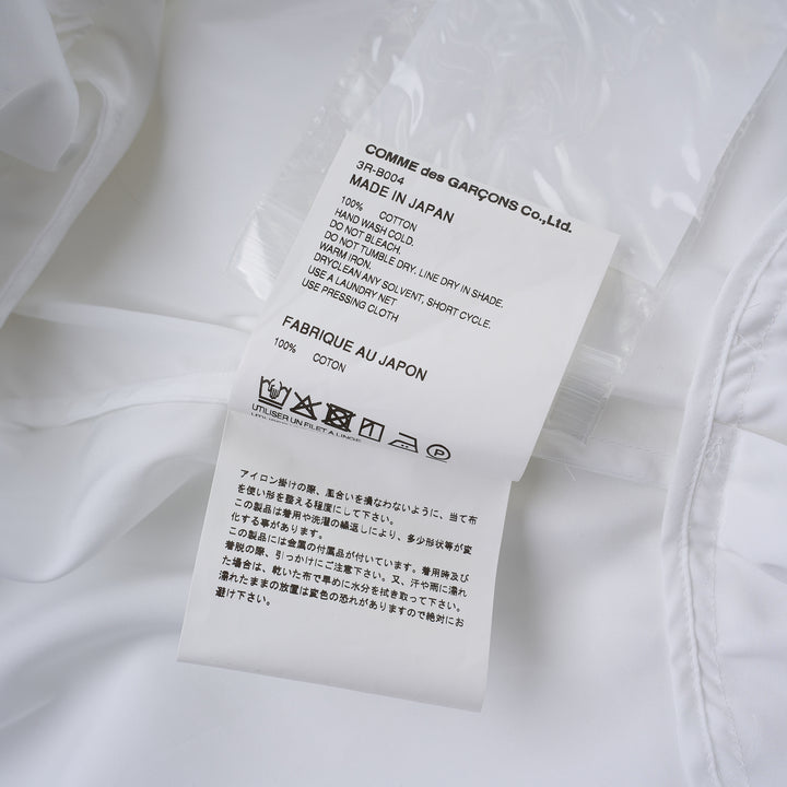 Noir Kei Ninomiya white cotton typewriter shirt with tiered pleated ruffle sleeves, pointed collar, button placket and curved flared hem - view 3