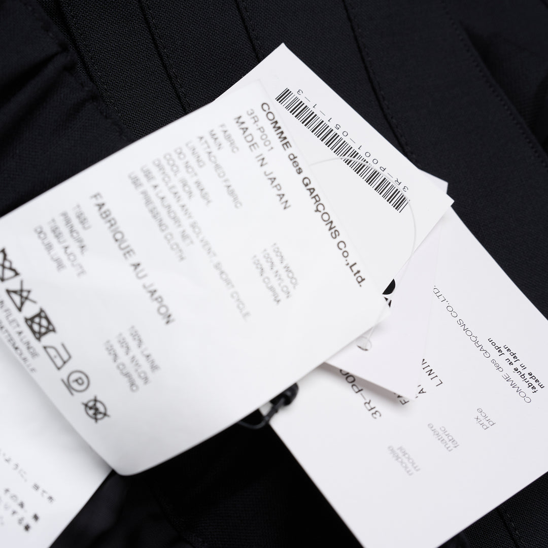 Noir Kei Ninomiya black wool tropical shorts with a stitched flared hem and layered black nylon tulle ruffles - view 6
