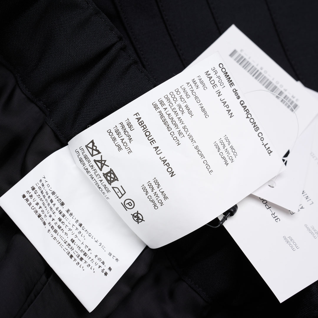 Noir Kei Ninomiya black wool tropical shorts with a stitched flared hem and layered black nylon tulle ruffles - view 7