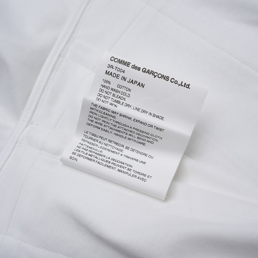 Noir Kei Ninomiya white cotton ponte top with corset-style seaming, puff sleeves, peplum hem and front zip closure - view 4