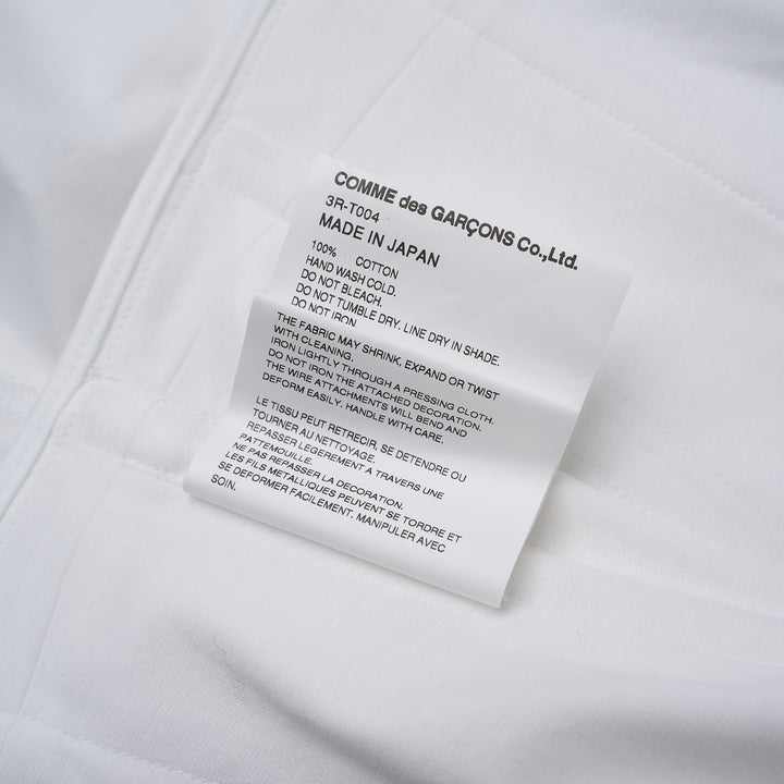 Noir Kei Ninomiya white cotton ponte top with corset-style seaming, puff sleeves, peplum hem and front zip closure - view 4