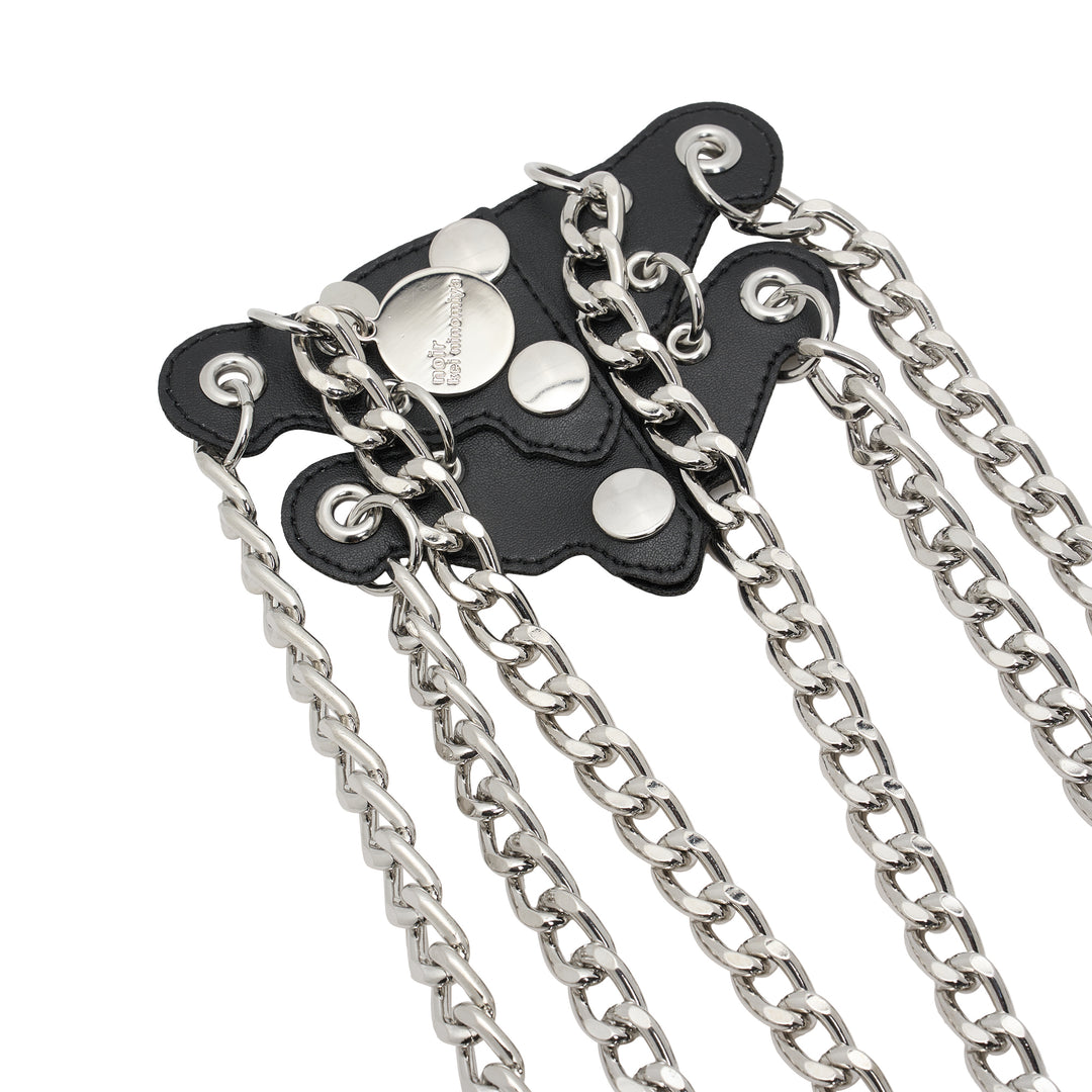 Noir Kei Ninomiya black synthetic leather vest with silver studs, grommets and cascading silver-tone curb chains