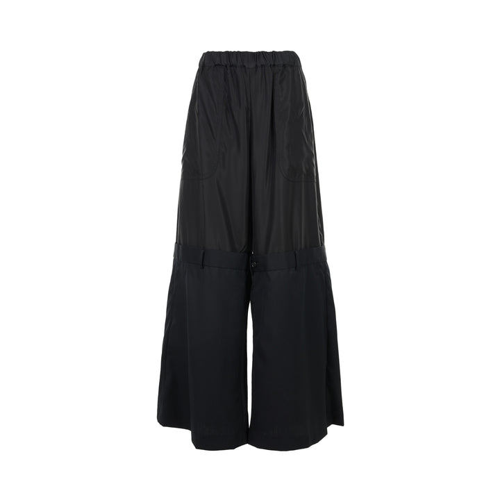 Noir Kei Ninomiya black wide-leg pants in cupra twill and wool gabardine with elasticated waist and layered tailored lower section