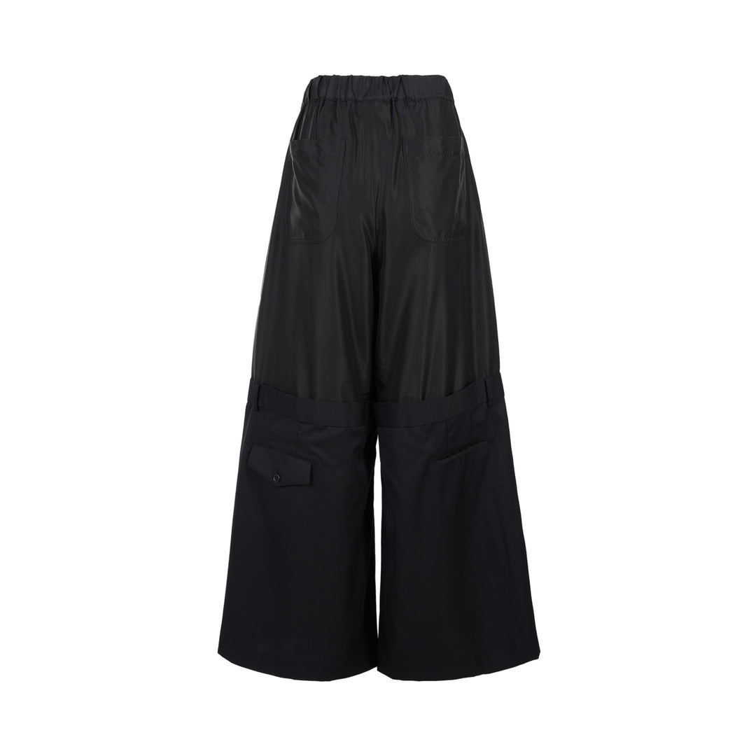 Noir Kei Ninomiya black wide-leg pants in cupra twill and wool gabardine with elasticated waist and layered tailored lower section - view 2