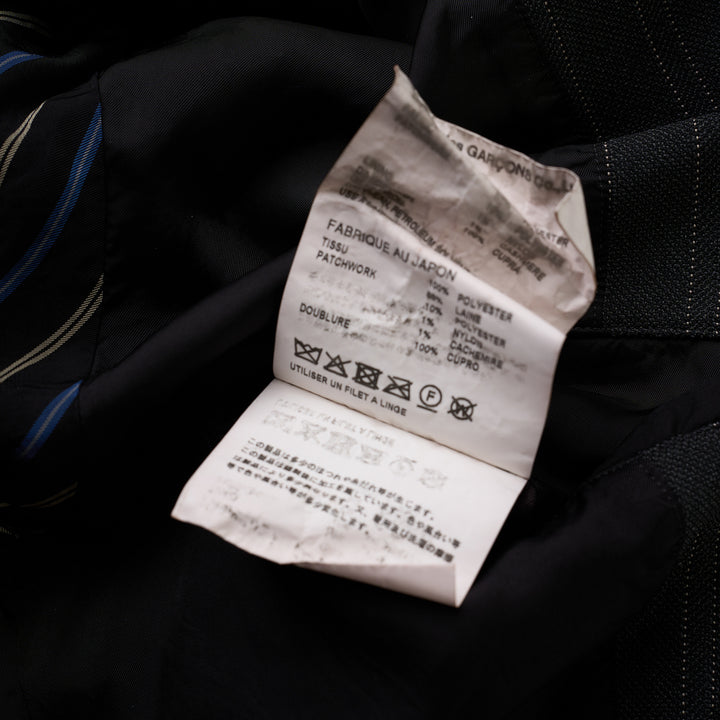 Junya Watanabe MAN charcoal pinstripe jacket with mixed wool patchwork panels, stand collar and flap pockets, front view - view 3