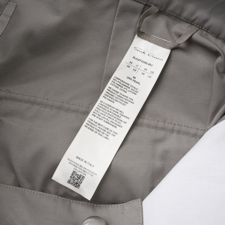Rick Owens Stefan cargo pants in a grey cotton-nylon ripstop with oversized flap pockets and a wide-leg silhouette, shown from the front - view 3