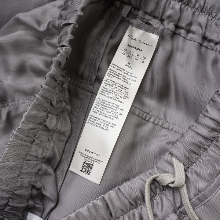 Rick Owens grey drawstring cropped pants with a dropped crotch, elasticated waistband and fluid, semi-sheer fabric, shown from the front - view 3