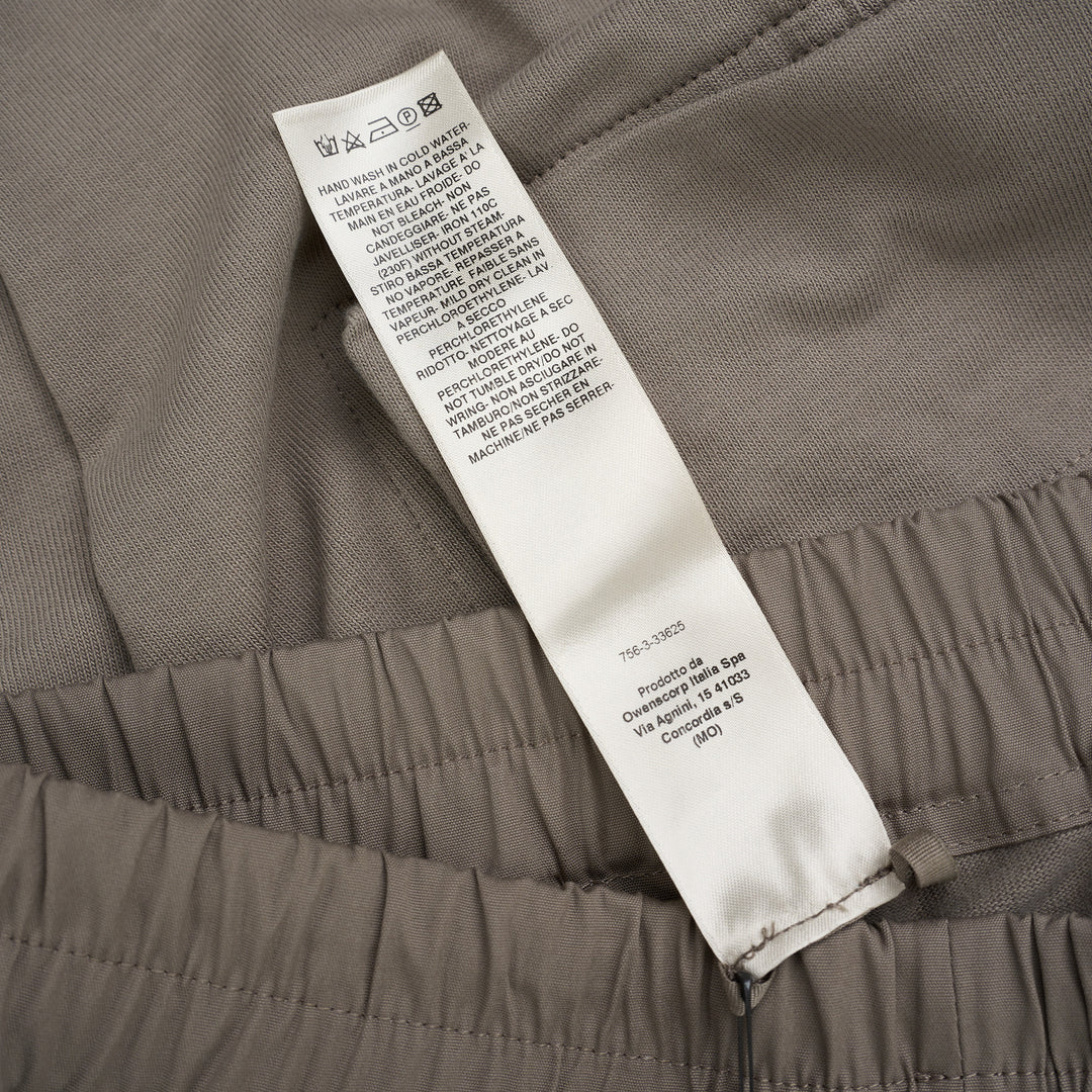 Back view of Rick Owens Mastodon cargo pants in taupe with flap back pockets, side cargo pockets and ribbed cuffs - view 5