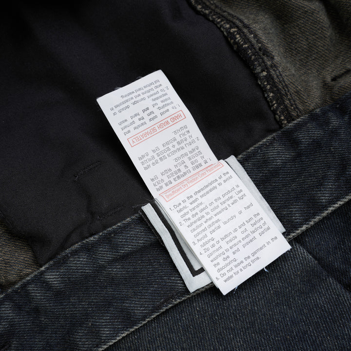 Wooyoungmi wide leg jeans in washed dark indigo denim with paneled knees and square metal waistband hardware, shown flat from the front - view 4