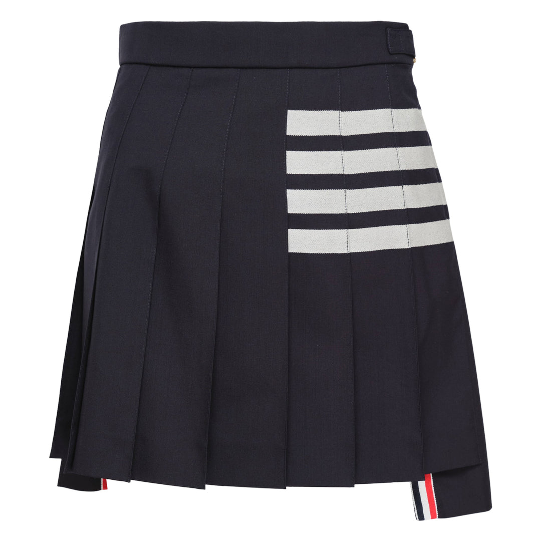 Thom Browne Mini Dropped Back Pleated Skirt in medium grey with white 4-bar stripes and grosgrain ribbon trim