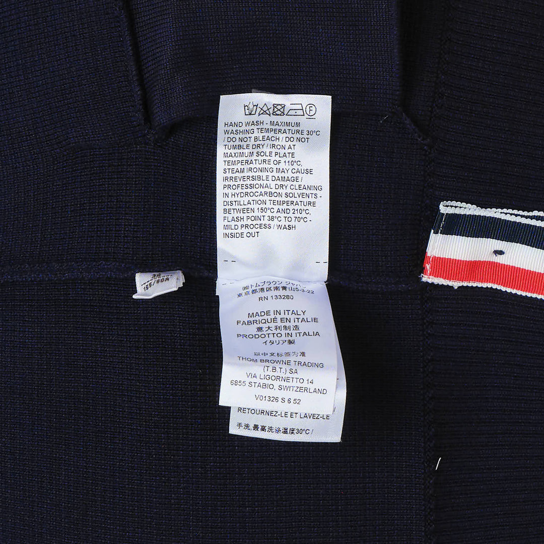 Thom Browne sky blue Milano stitch cardigan with four white bar stripes on the sleeve, V-neck, button front, and patch pockets