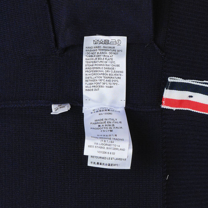 Thom Browne sky blue Milano stitch cardigan with four white bar stripes on the sleeve, V-neck, button front, and patch pockets
