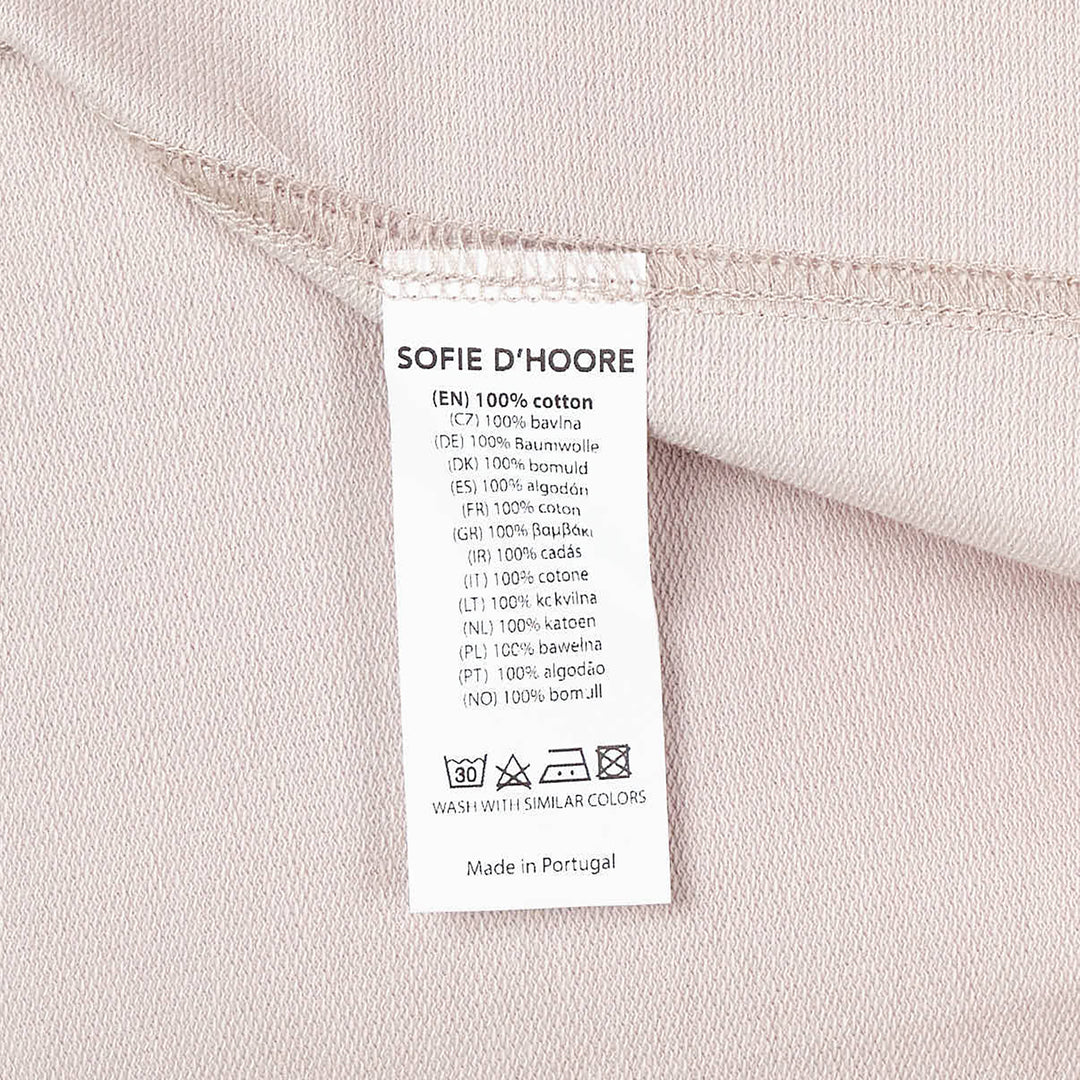 Sofie D'Hoore short sleeve boxy tee in dusty rose with ribbed crew neck and topstitched hem, displayed flat on white background