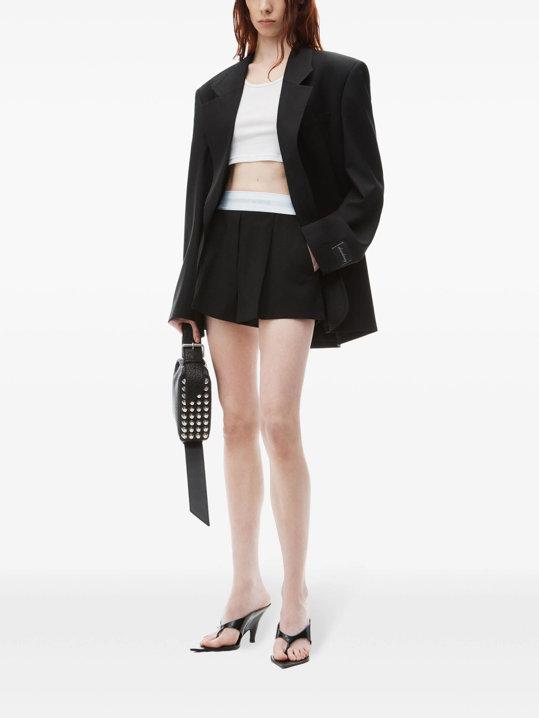 Alexander Wang black high-waist pleated short with white logo elastic waistband, front view on white background