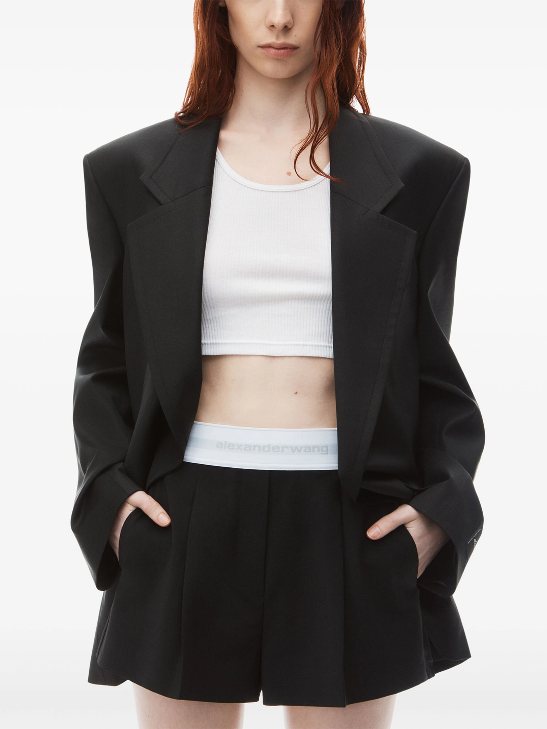 Alexander Wang black high-waist pleated short with white logo elastic waistband, front view on white background