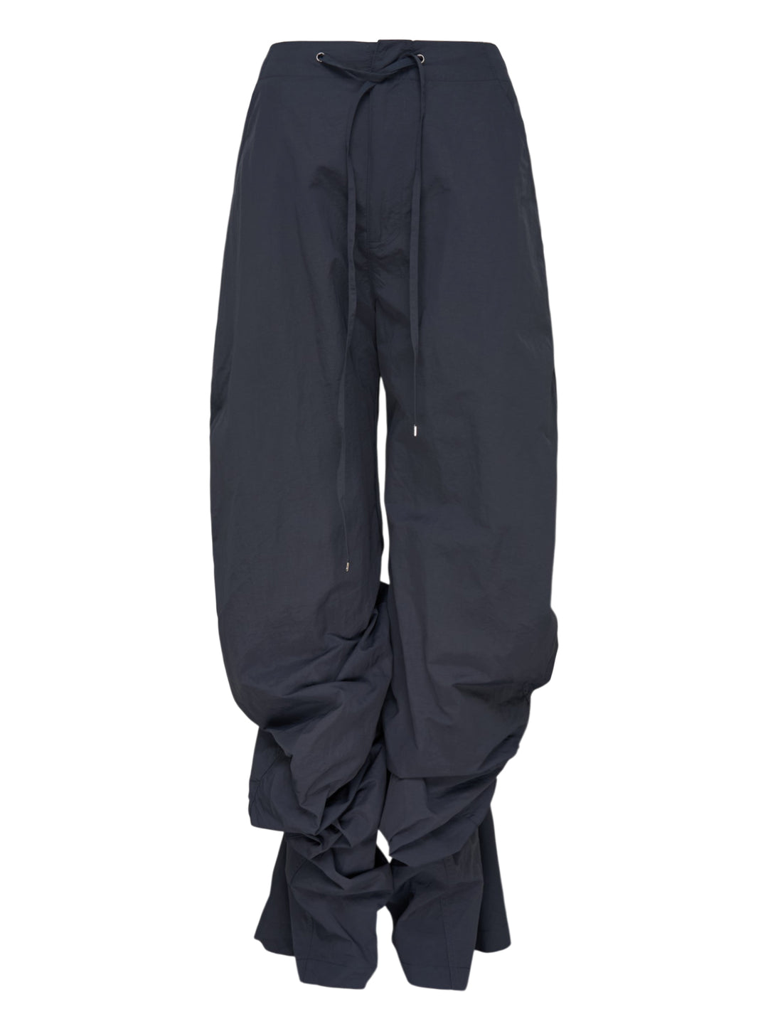 Dark navy wide-leg Nache nylon pants with a drawstring waist and ruched, pintucked hems, shown from the front
