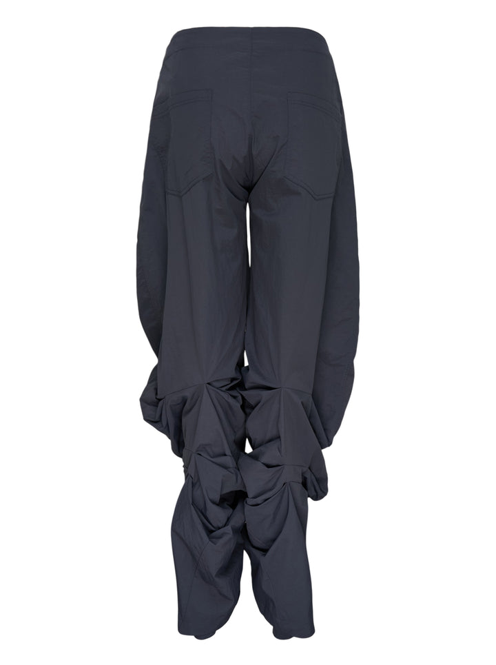 Dark navy wide-leg Nache nylon pants with a drawstring waist and ruched, pintucked hems, shown from the front - view 2