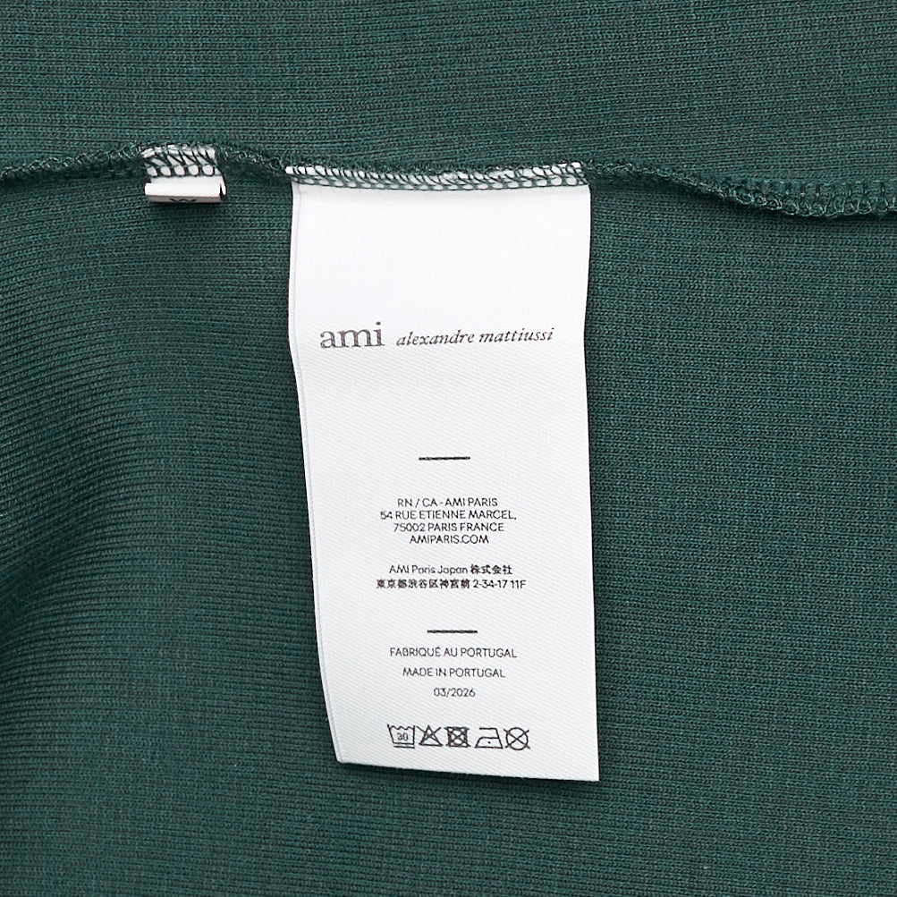 AMI Alexandre Mattiussi heather grey ribbed tank top with Ami de Cœur heart-and-A logo embroidered at the chest, front view on white background