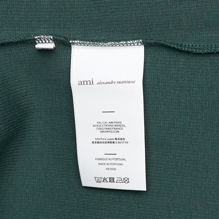 AMI Alexandre Mattiussi heather grey ribbed tank top with Ami de Cœur heart-and-A logo embroidered at the chest, front view on white background