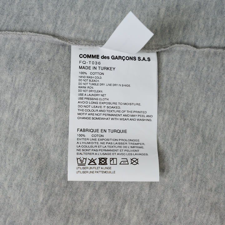 COMME des GARCONS SHIRT Oversized Printed Humanity T-Shirt – Available at Club 21, Official Retailer in Singapore, Malaysia & Thailand with Global Shipping Online