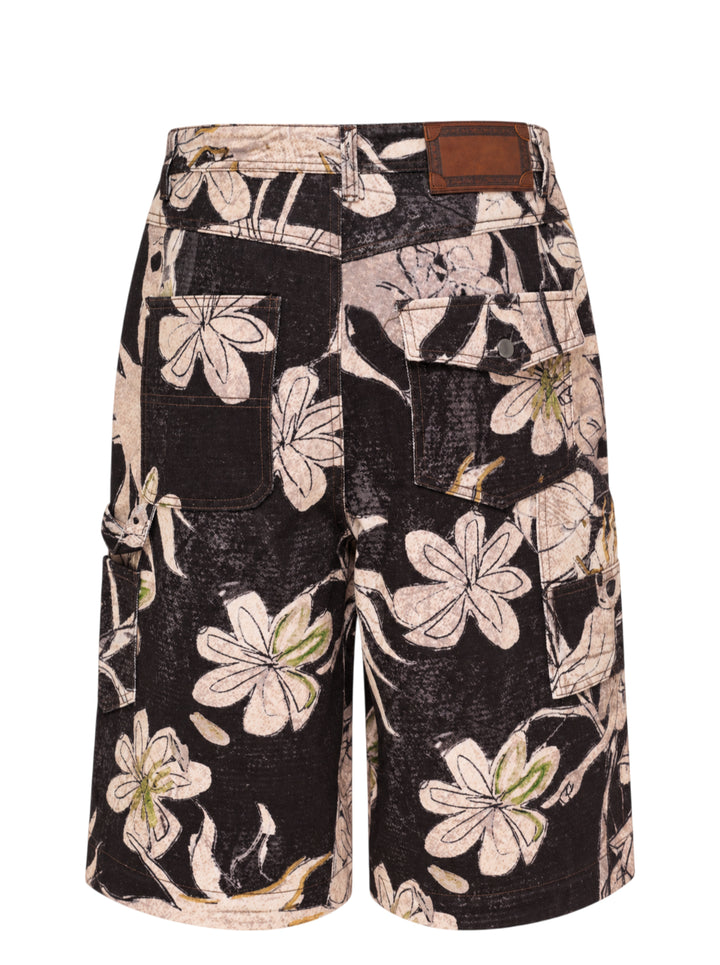 Andersson Bell carpenter shorts with an all-over black and cream floral and alien print, gold embroidered accents, and utility pocket detailing - view 2