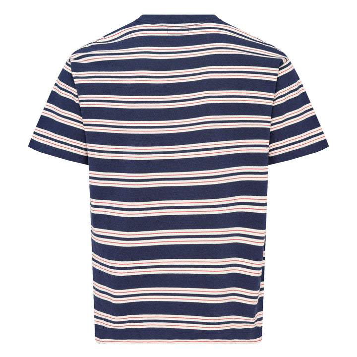 Human Made Striped Short Sleeve Tee in sky blue with horizontal multicolour stripes in cream, yellow, and blush, featuring an embroidered yellow heart logo patch at the chest
