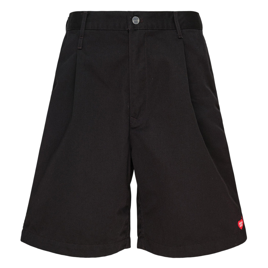 Human Made Skater Shorts in black with embroidered heart-and-arrow logo near the hem and yellow woven brand label at the waistband