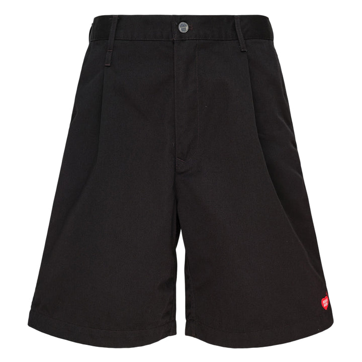 Human Made Skater Shorts in black with embroidered heart-and-arrow logo near the hem and yellow woven brand label at the waistband