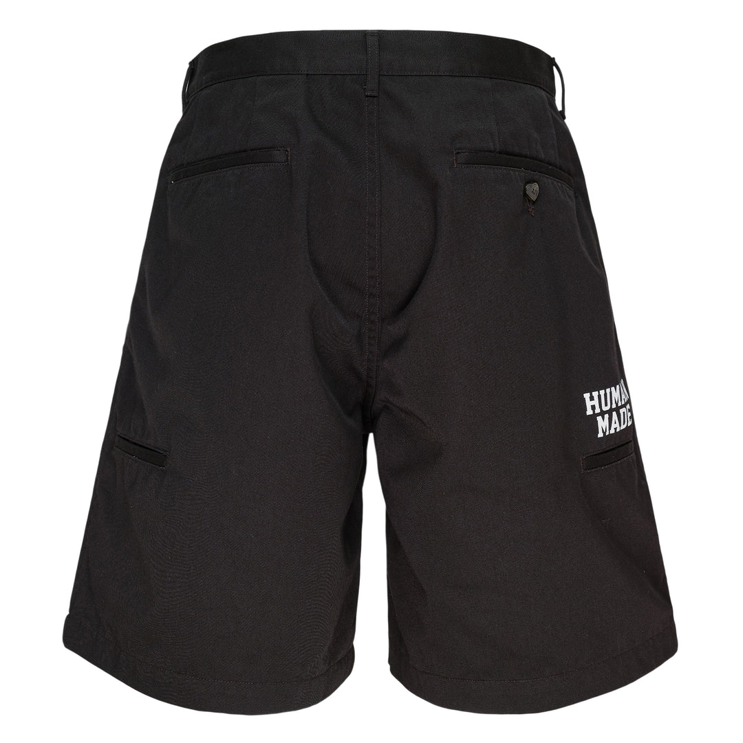 Human Made Skater Shorts in black with embroidered heart-and-arrow logo near the hem and yellow woven brand label at the waistband