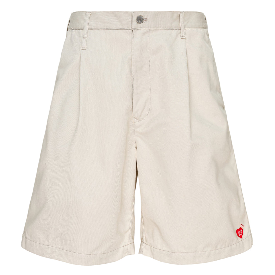 Human Made Skater Shorts in black with embroidered heart-and-arrow logo near the hem and yellow woven brand label at the waistband