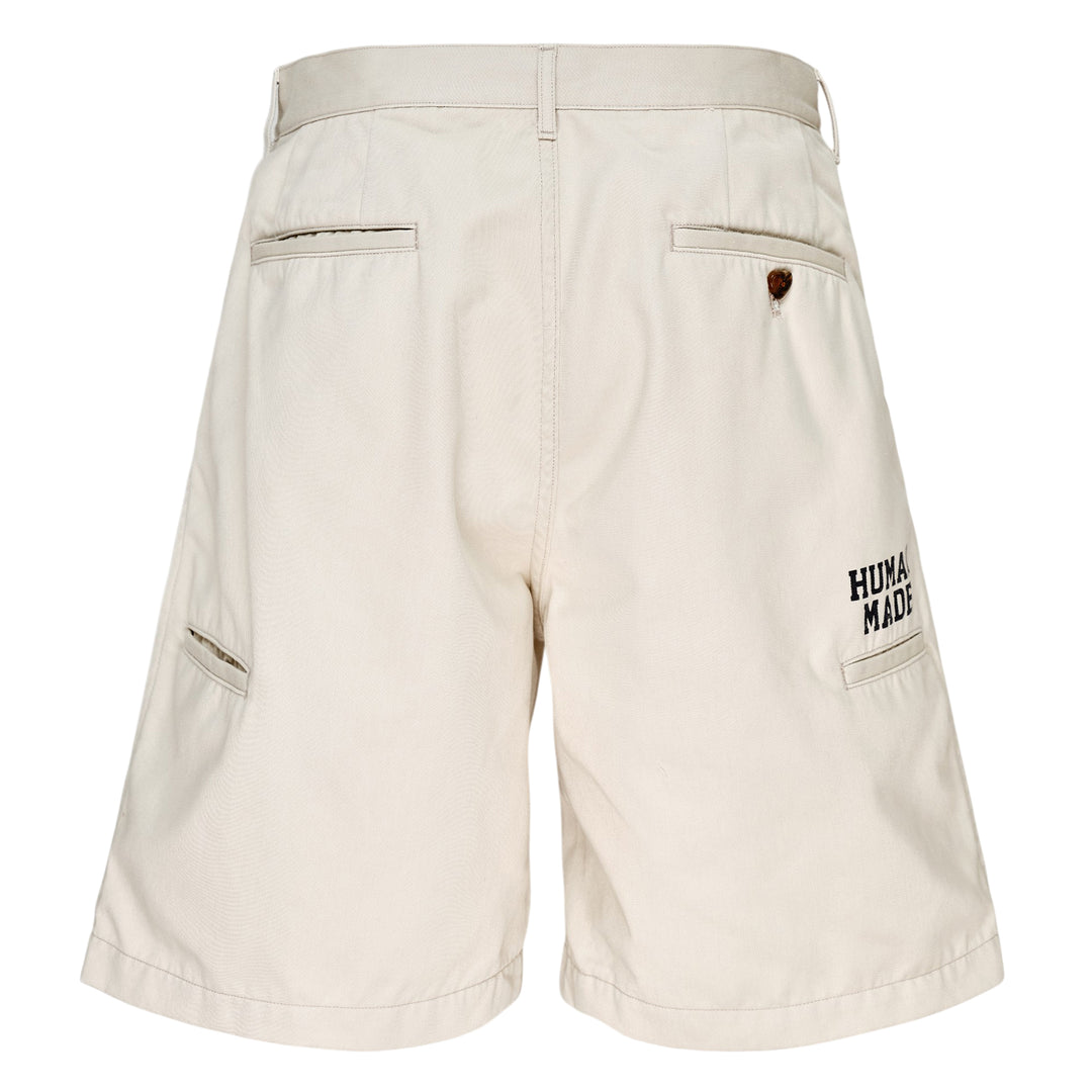 Human Made Skater Shorts in black with embroidered heart-and-arrow logo near the hem and yellow woven brand label at the waistband