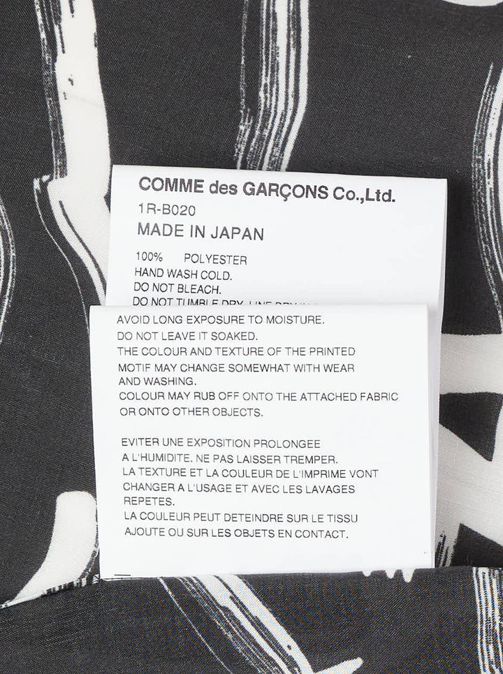 Comme des Garçons BLACK Filip Pagowski long sleeve oversized shirt in black polyester lawn with all-over white brushstroke and fragmented letter print - view 4