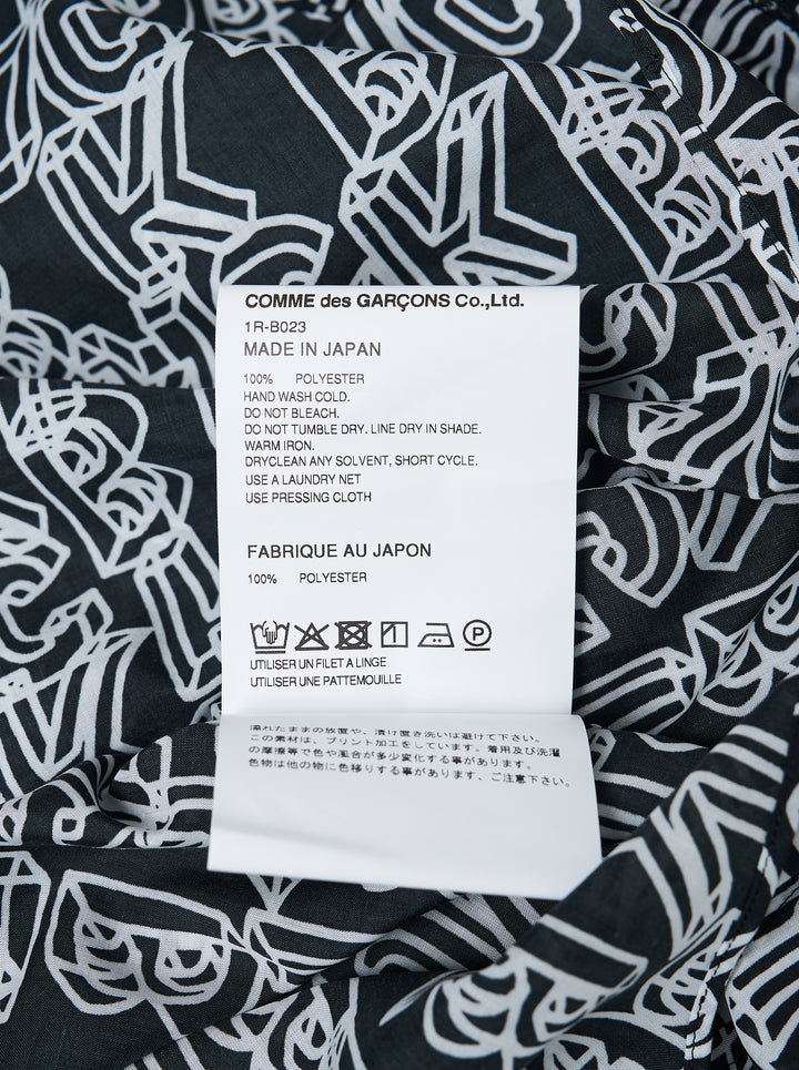 Comme des Garçons Black long sleeve hooded shirt with Filip Pagowski all-over 'BLACK' text print in white outline lettering on a dark ground, back view - view 3