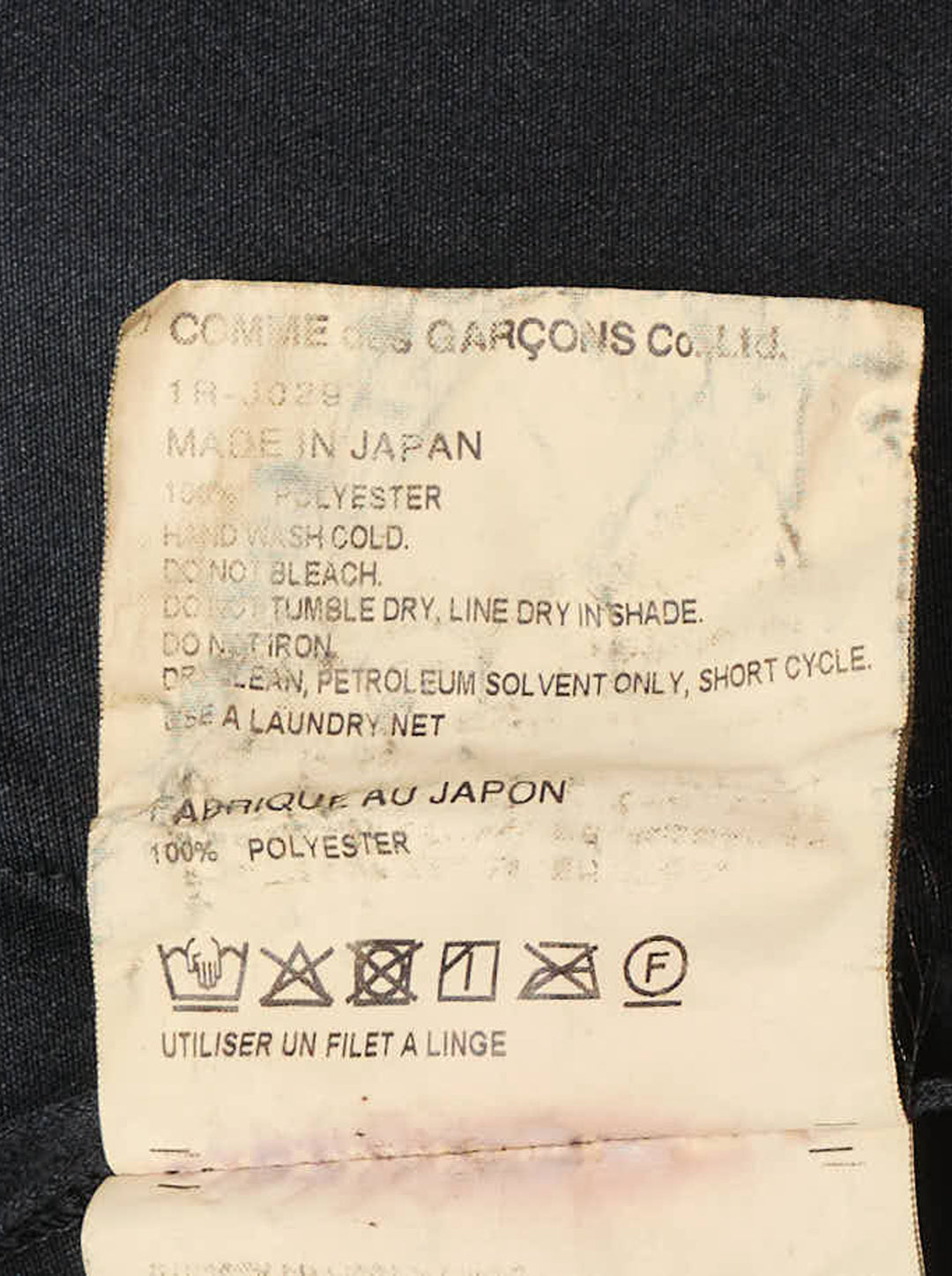 Comme des Garçons BLACK heavy polyester satin jacket in black, featuring a mandarin collar, three frog-button closures, and two patch pockets on a white background - view 3